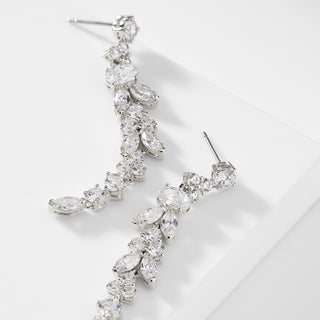 IMAGE OF THE PRIMA CZ LONG LINEAR EARRINGS IN RHODIUM PLATING WITH EARRINGS TURNED ON THEIR SIDE TO SHOW THE POSTS.