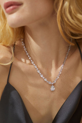 image of model wearing the cz pear drop necklace